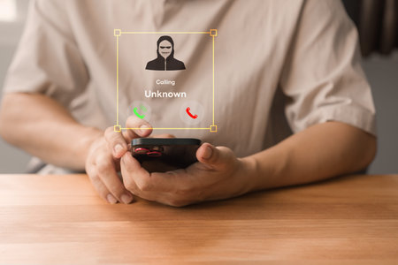 Fraud with a phone from the scammer. Person answering the incoming call. Phone call was from an unknown number. Call center gang or stranger. Hoax person with a fake identity, bad of scam.の写真素材