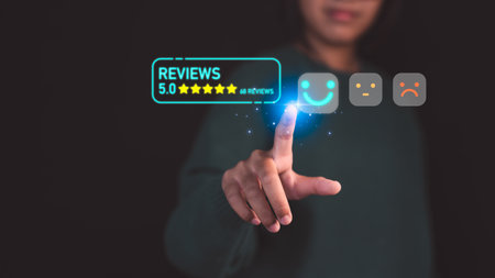 Customer select a happy face icon on digital feedback. Concept of customer satisfaction, testimonials, online reviews, user feedback, review rankings and service quality.の写真素材