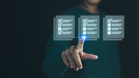 Hand person pointing at a virtual checklist with complete task, symbolizing task management, customer service, quality control, productivity and efficient work processes in a digital environment.の写真素材