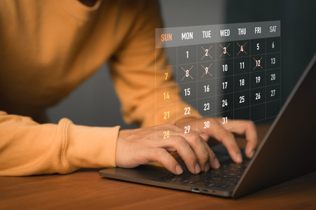 Freelancer using laptop with digital calendar interface, scheduling event and planning task. Concept...