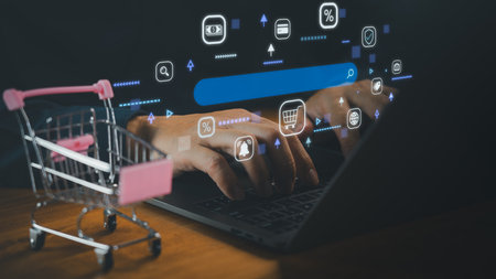 E-commerce technology concept with businessman using laptop and shopping cart, online retail, digital marketing, product search, secure payment, shop online, and modern internet shopping solution.の写真素材