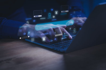 Man using a laptop computer with digital interface for video content moderation. Concept of online...