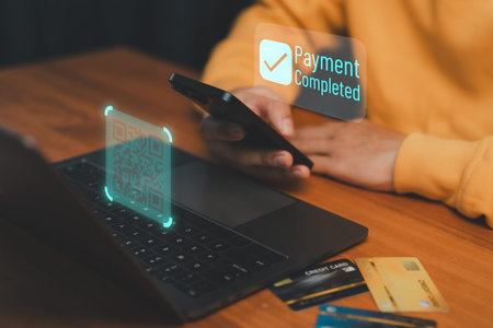 Mobile payment with QR code and smartphone, showing successful online transaction. Concept of...