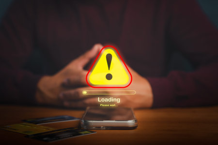 Warning alert symbol with loading bar on smartphone screen, showing error or system failure concept...