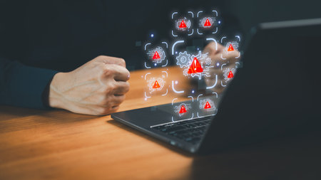 Frustrated user with clenched fists facing AI system errors and cybersecurity alerts on a laptop....