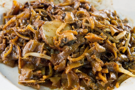 Singapore Stir Fry Char Kway Teow Noodles with Cockles and Fish Cakeの写真素材