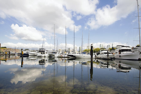 Marina Reflection of Boats and Clouds in the Sky at Granville Island in Vancouver BC Canada