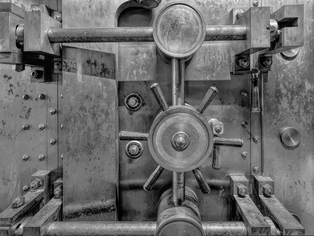 Old Bank Vault in Basement of Historic Building in Black and White Grunge Texture Closeupの写真素材