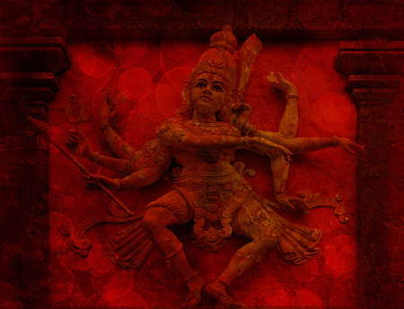 Nataraj Dancing Form of Lord Shiva Hindu God Statue on Temple Exterior Wall Relief in Red Grunge Texture Backgroundの写真素材