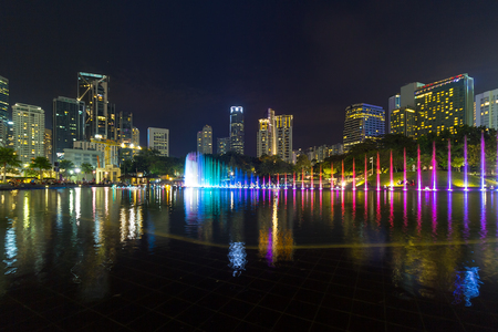 Kuala Lumpur Malaysia City Skyline from KLCC Park by Symphony Lake at Nightの写真素材
