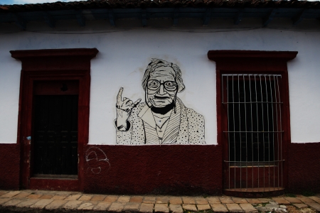 Street art of a grandma showing a rock gestureの素材