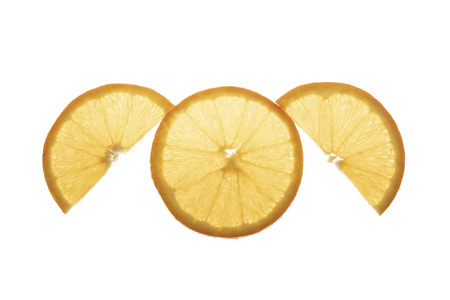 One slice orange and two half slice on a white backgroundの写真素材