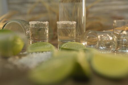 Many slices of lemon accompanied by shot's of tequila - Close-upの写真素材