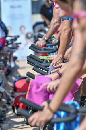 Peniscola, Castellon, Spain, August 31, 2019: Photo detail of stationary bicycles in a sports event with a selective focus. Concept of healthy living.のeditorial素材