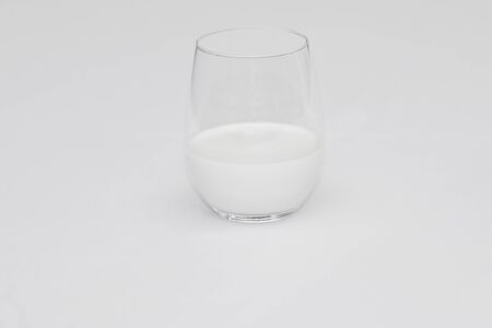 A glass of milk Isolated on a white backgroundの写真素材