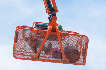 Worker on a telescopic boom lift platform