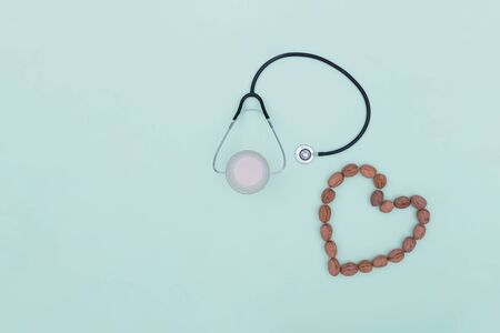 Stethoscope with a heart shape made of walnutsの写真素材