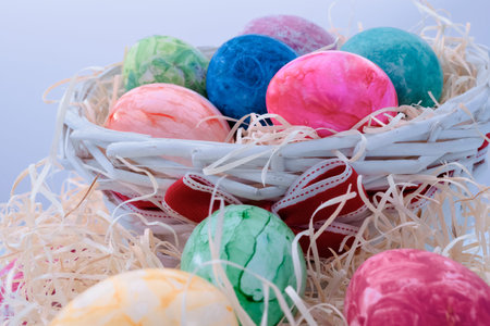 Assorted easter eggs in a wicker basket