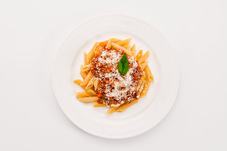 view of an appetizing plate of cooked pasta with bolognese sauceの写真素材