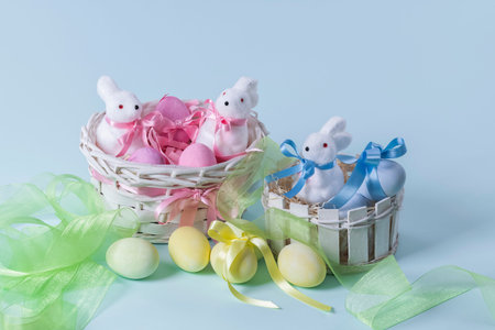 baskets of painted eggs and figurines with ribbons