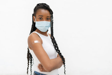 Afro american woman with bandage after vaccination: Selective focus. Vaccination concept.