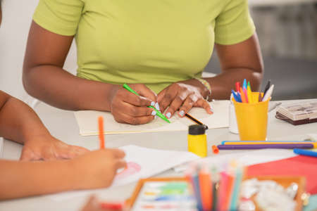 Close-up view of a teacher drawing in art class.の写真素材