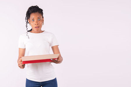 Afro american woman holding a box of chocolate sweets