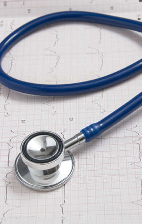 Stethoscope blue with background electrocardiogram, vertical photoの写真素材