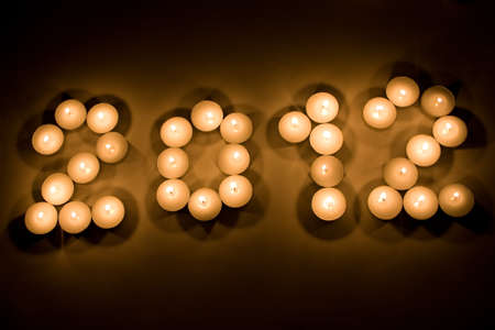 Lighted candles forming the 2012 figureの写真素材