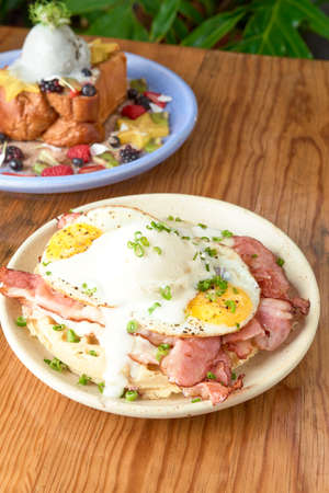 delicious waffle on wooden table. delicious breakfast waffles.の写真素材