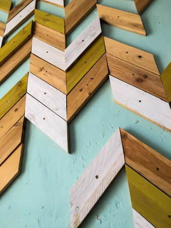 Arrow art on a teal wallの写真素材