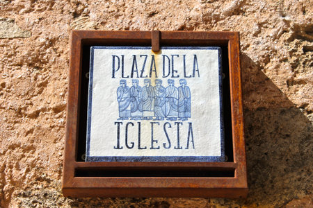 Street sign meaning Church Square in the medieval town of Medinaceli, in Spain. Summer 2014の写真素材