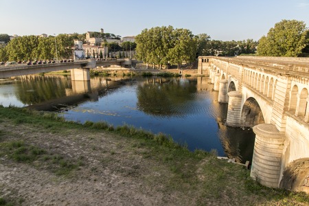 The Pont-canal de l'Orb in Beziers, a canal bridge part of the Canal du Midi in Southern France, with the city of Beziers and other bridge in the background. A world heritage site since 1996のeditorial素材