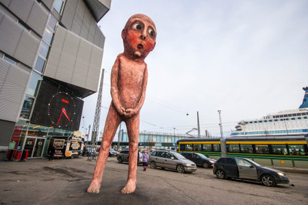 The sculpture Bad Bad Boy, a giant peeing man by artist Tommi Toija in the port of Helsinki, Finlandのeditorial素材