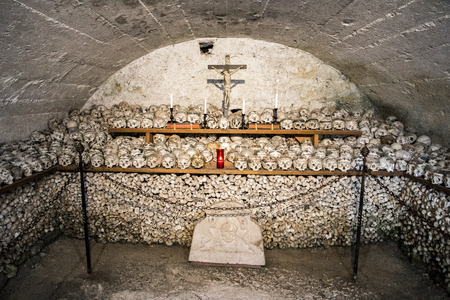 Skulls painted with names, colorful flowers and crosses in the Charnel House or Beinhaus, Hallstatt, Austriaのeditorial素材