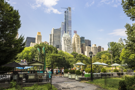 New York City. Views of Central Park South from Central Park, with notable buildings including Hampshire House and JW Marriott Essex House luxury hotelのeditorial素材