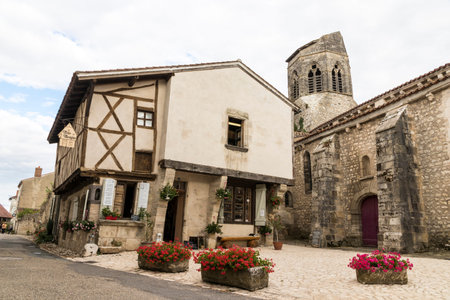 Charroux, France. Half-timbered house and church tower in one of the most beautiful villages in the Allier department in Auvergneのeditorial素材