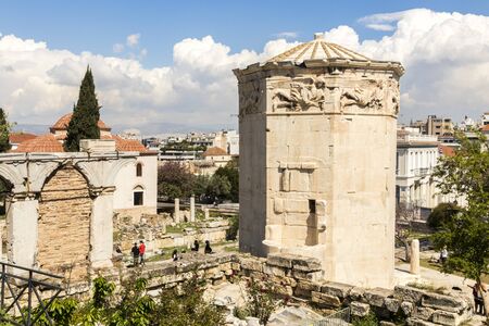 Athens, Greece. The Tower of the Winds, or the Horologion of Andronikos Kyrrhestes, an octagonal Pentelic marble clocktower in the Roman Agoraの写真素材