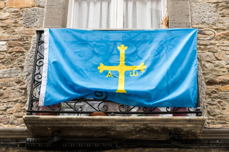 Cangas del Narcea, Spain, Flag of the Principality of Asturias hanging from a balconyの写真素材