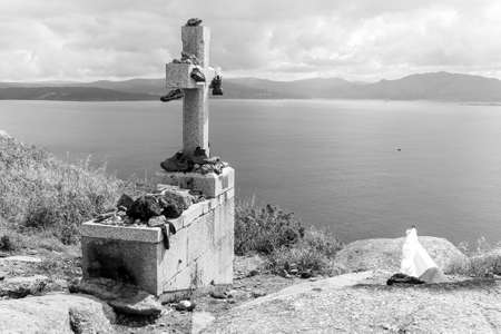 Fisterra, Spain. The cross at Cabo Finisterre (Cape Finisterre), final point of the Way of St James (Camino de Santiago)のeditorial素材