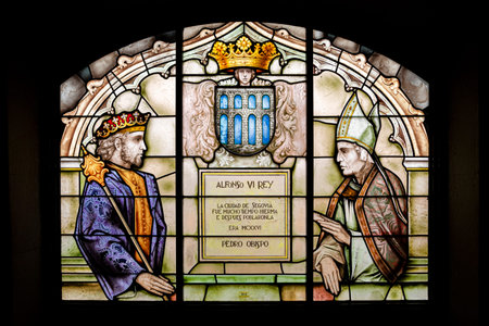 Segovia, Spain. Coat of arms of the city of Segovia, with King Alfonso VI of Leon and Castile, and Bishop Pedro, in a stained glass window inside the Alcazarのeditorial素材