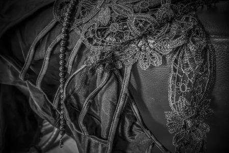 Closeup of black lace and silk.の写真素材