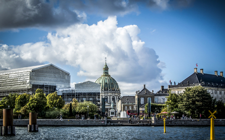 Copenhagen, Denmark â September 26th 2014: The dome of Frederik's Church and statue of King Frederick V in Copenhagen, viewed from a boatのeditorial素材