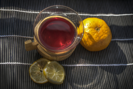 Top view of a cup of mulled red wine with an orange and lemon slicesの写真素材