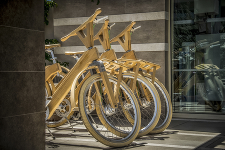 A group of wooden bicycles on the streetの写真素材