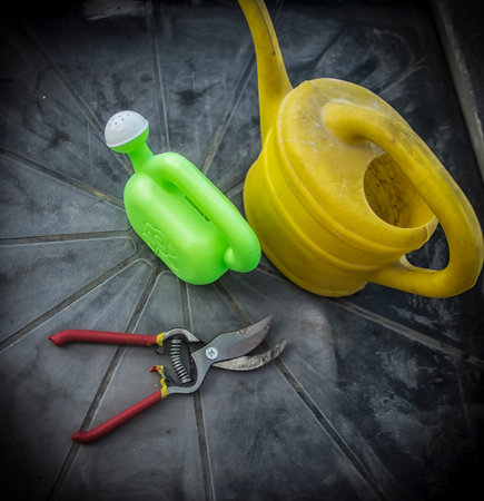 Buckets and gardening scissors on a balcony table