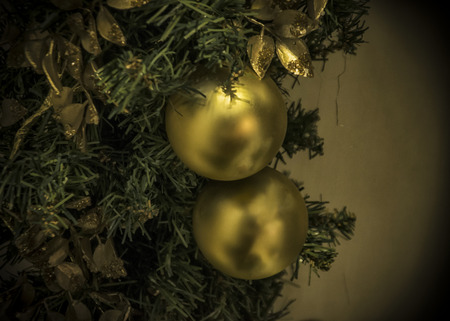 Two golden balls on a Christmas treeの写真素材