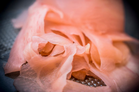 A macro shot of marinated ginger for sushi
