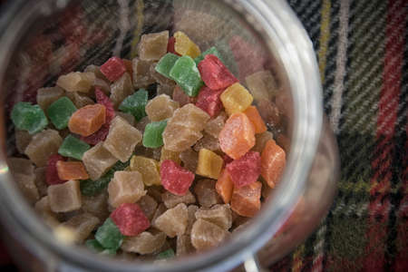 Colorful sugared fruit candies in a glass jarの写真素材