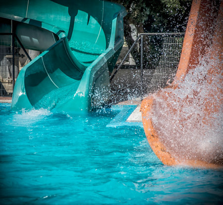 Details of blue and orange slides in an aqua parkの写真素材